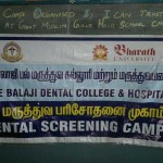 Photograph  showing the banner of Sri Balaji Dental College & Hospital conducting the Dental screening camp on 3rd October