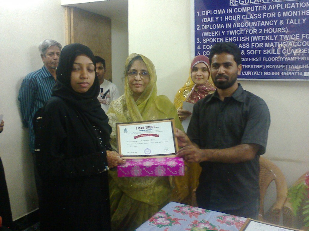 B. Shenaz Begum receiving the Second Prize Certificate